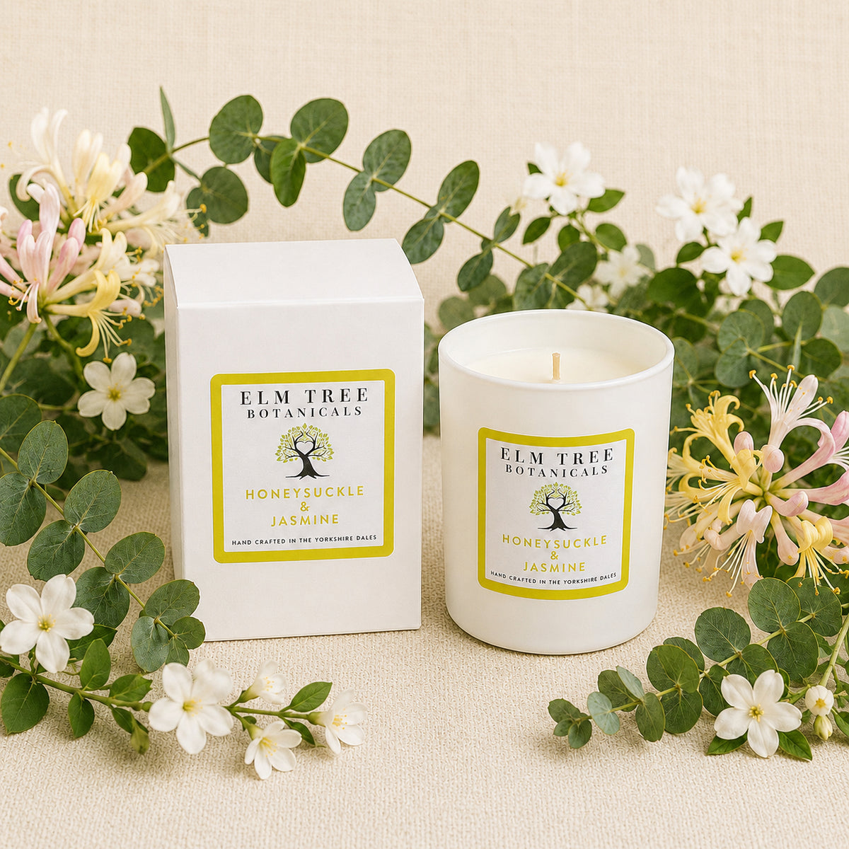 Elm Tree Botanicals candle and packaging with floral elements on a beige background