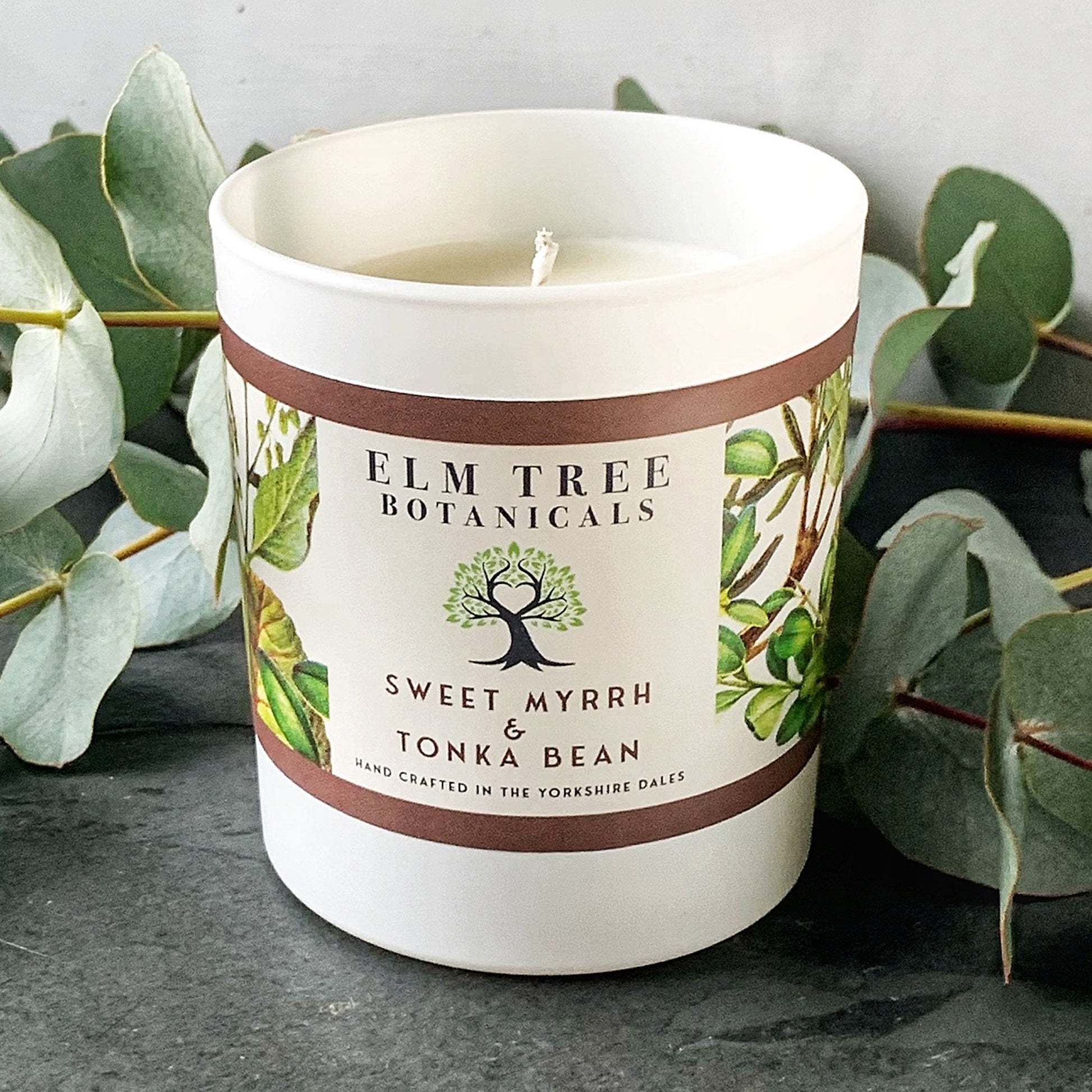 Sweet Myrrh & Tonka Bean Medium Candle with foliage